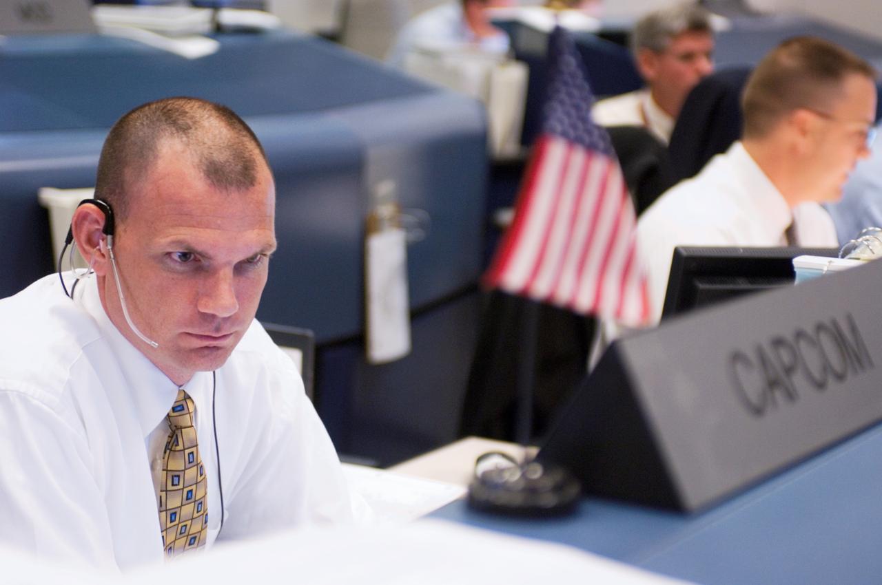JSC2007-E-28297 (8 June 2007) --- Astronaut Dominic A. (Tony) Antonelli, STS-117 spacecraft communicator (CAPCOM), monitors data at his console in the space shuttle flight control room of Johnson Space Center's Mission Control Center (MCC) following the launch of Space Shuttle Atlantis. Liftoff occurred at 7:38 p.m. (EDT) on June 8, 2007 from launch pad 39A at Kennedy Space Center.