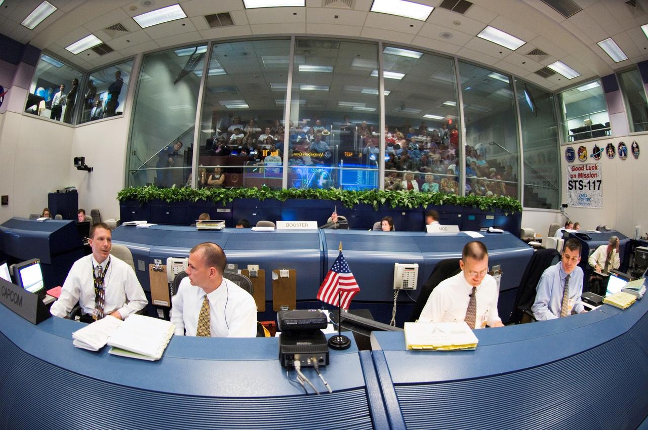 JSC2007-E-28303 (8 June 2007) --- A "fish-eye" lens perspective of activity in the shuttle flight control room of Houston's Mission Control Center, as flight controllers anticipate an ontime launch for STS-117 several hundred miles away at the Kennedy Space Center. From the left are astronauts Terry Virts and Dominic (Tony) Antonelli, both spacecraft communicators (CAPCOM), along with flight directors Norm Knight (ascent) and Steve Stich.