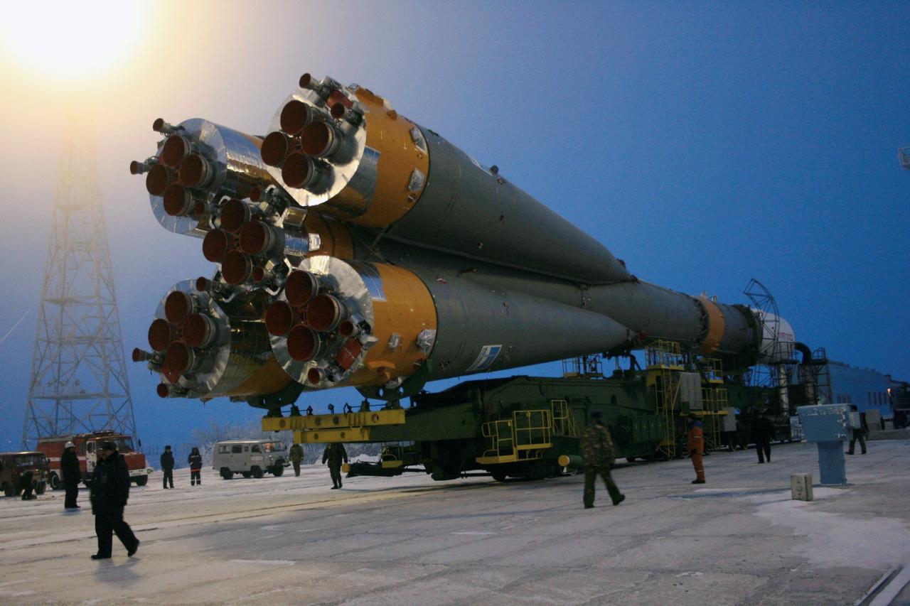 JSC2007-E-03081 (16 Jan. 2007) --- Roll-out of the Progress 24 vehicle occurred on schedule at 7:00 a.m., Jan. 16, 2007 at the Baikonur Cosmodrome, Kazakhstan.    The vehicle was in the vertical and hard-down at the pad by 9:30 a.m. The gantry towers were placed around the vehicle shortly thereafter. Progress is targeted for launch on Jan. 18, 2007 for a two-day trip to the International Space Station carrying 2 1/2 tons of food, fuel and supplies for the Expedition 14 crew. Photo Credit: NASA