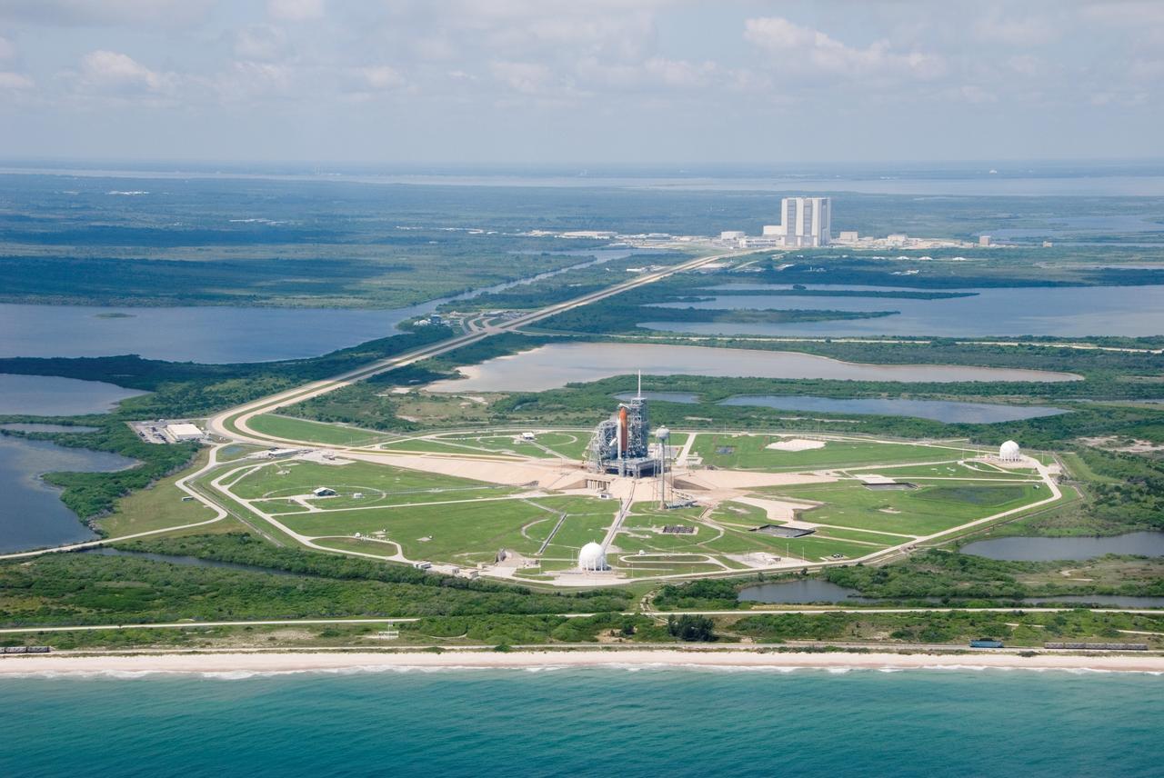 JSC2007-E-40800 (5 Aug. 2007) --- An aerial view of part of the Kennedy Space Center's giant complex featuring the Space Shuttle Endeavour and its support stack of hardware on launch pad 39A, the Vehicle Assembly Building (VAB) and surrounding area. Endeavour's launch is scheduled for Aug. 8, 2007 at 6:36 p.m. (EDT) to begin the STS-118 mission. This image was photographed from a NASA T-38 aircraft.
