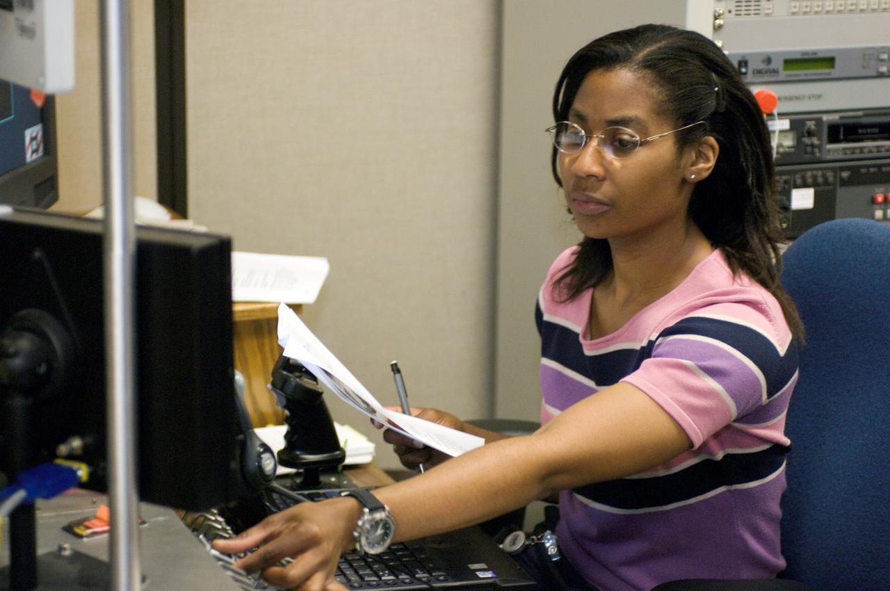 JSC2007-E-41532 (9 Aug. 2007) --- Astronaut Stephanie D. Wilson, STS-120 mission specialist, uses the virtual reality lab at Johnson Space Center to train for her duties aboard the space shuttle and space station. This type of computer interface, paired with virtual reality training hardware and software, helps to prepare the entire team for dealing with space station elements.