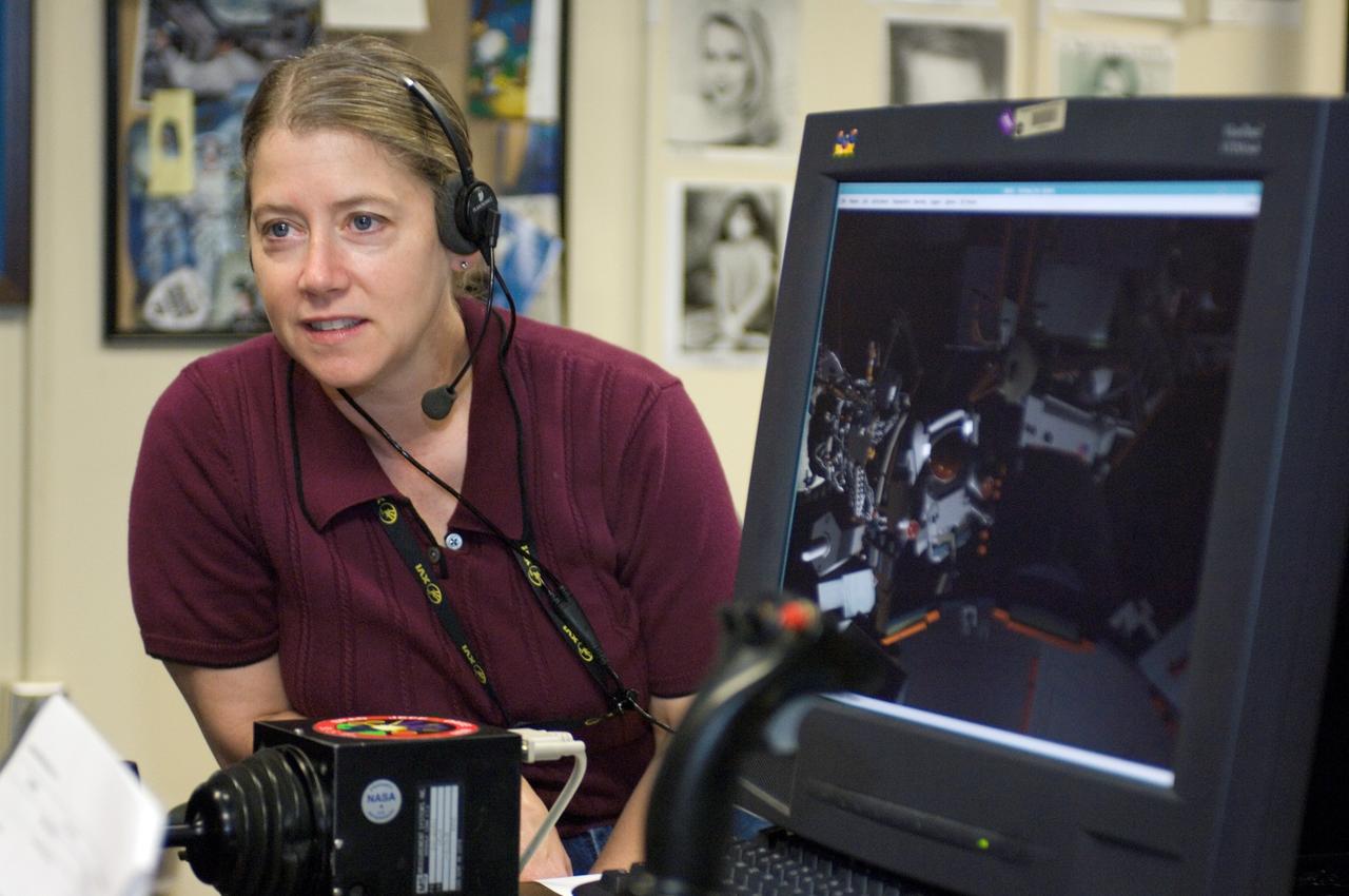 JSC2007-E-41539 (9 Aug. 2007) --- Astronaut Pamela A. Melroy, STS-120 commander, uses the virtual reality lab at Johnson Space Center to train for her duties aboard the space shuttle and space station. This type of computer interface, paired with virtual reality training hardware and software, helps to prepare the entire team for dealing with space station elements.