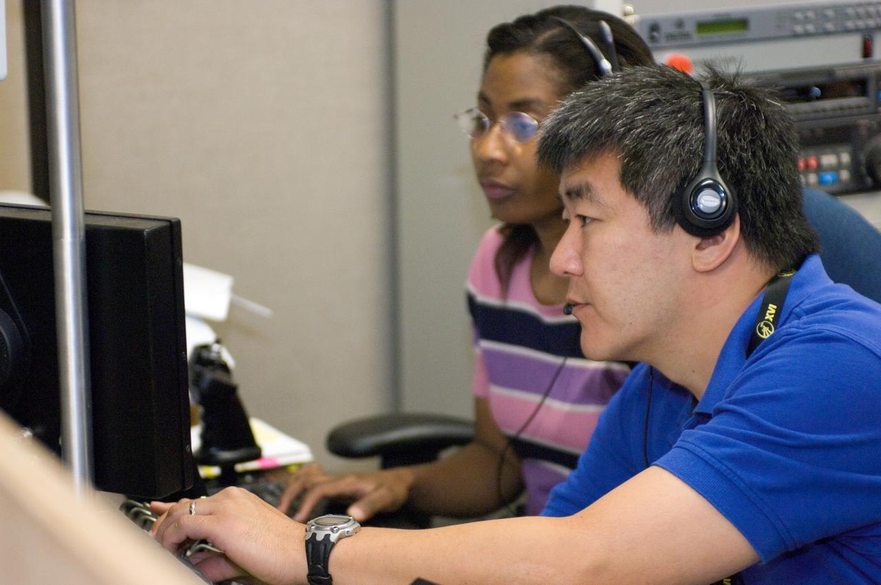 JSC2007-E-41541 (9 Aug. 2007) --- Astronauts Stephanie Wilson, STS-120 mission specialist, and Dan Tani, Expedition 16 flight engineer, use the virtual reality lab at Johnson Space Center to train for their duties aboard the space shuttle and space station. This type of computer interface, paired with virtual reality training hardware and software, helps to prepare the entire team for dealing with space station elements.