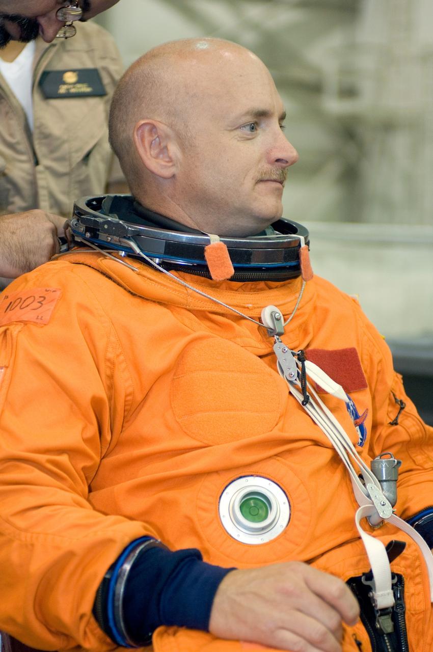 JSC2007-E-43407 (15 Aug. 2007) --- Attired in a training version of his shuttle launch and entry suit, astronaut Mark E. Kelly, STS-124 commander, awaits the start of a water survival training session in the Neutral Buoyancy Laboratory (NBL) near Johnson Space Center.