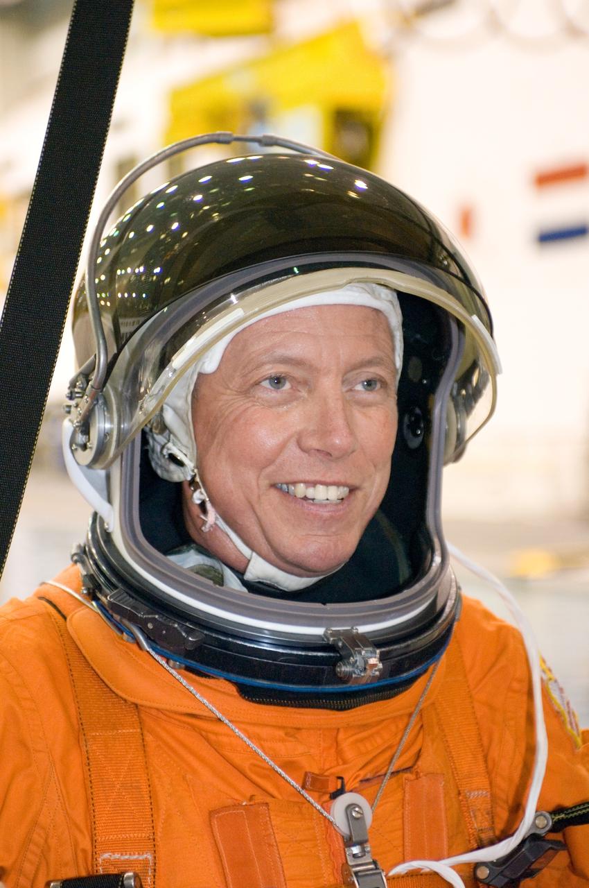 JSC2007-E-43438 (15 Aug. 2007) --- Attired in a training version of his shuttle launch and entry suit, astronaut Michael E. Fossum, STS-124 mission specialist, awaits the start of a water survival training session in the Neutral Buoyancy Laboratory (NBL) near Johnson Space Center.