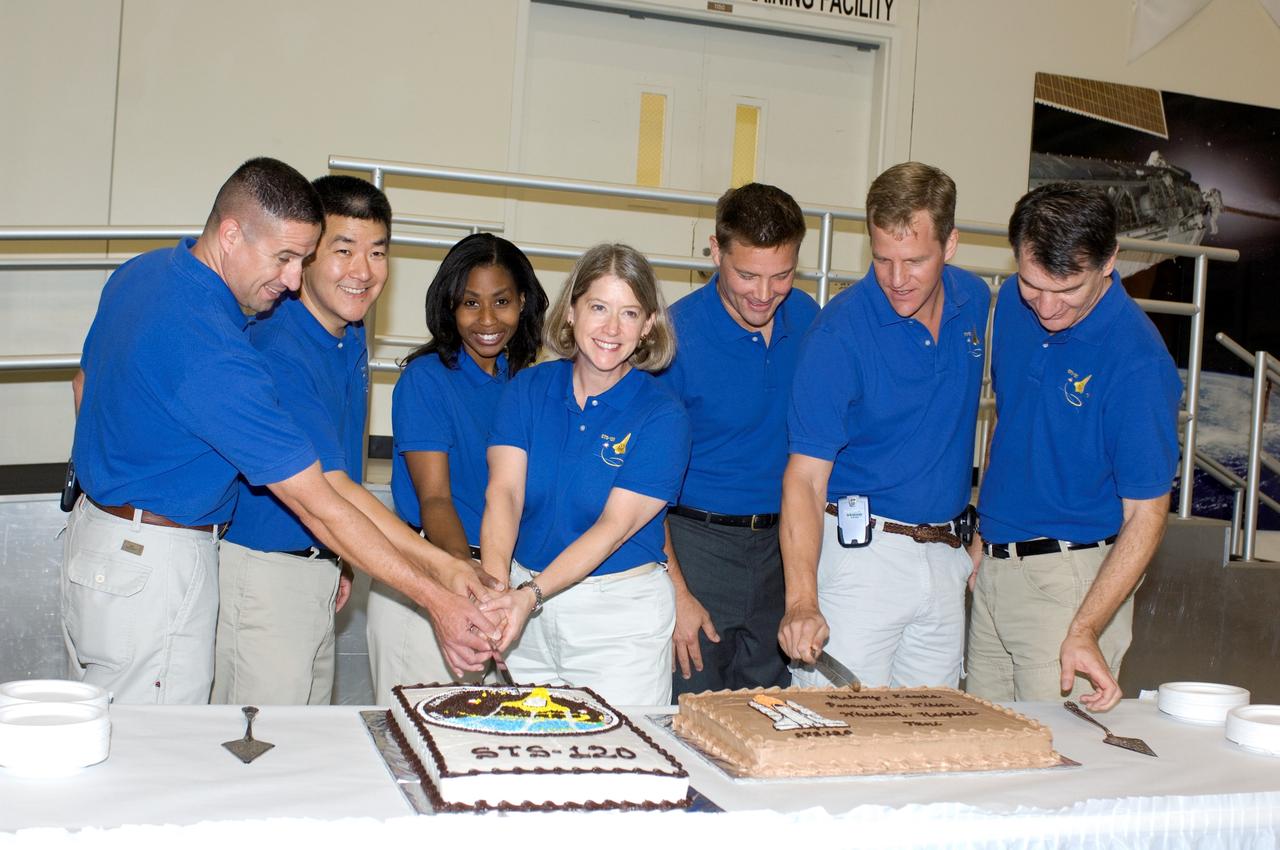 JSC2007-E-44684 (29 Aug. 2007) --- The STS-120 crewmembers celebrate the end of formal crew training with a cake-cutting ceremony in the Jake Garn Simulation and Training Facility at Johnson Space Center. Pictured from the left are astronauts George D. Zamka, pilot; Daniel M. Tani, Expedition 16 flight engineer; Stephanie D. Wilson, mission specialist; Pamela A. Melroy, commander; Douglas H. Wheelock, Scott E. Parazynski, and European Space Agency's (ESA) Paolo Nespoli, all mission specialists. Tani is scheduled to join Expedition 16 after launching to the International Space Station on mission STS-120.