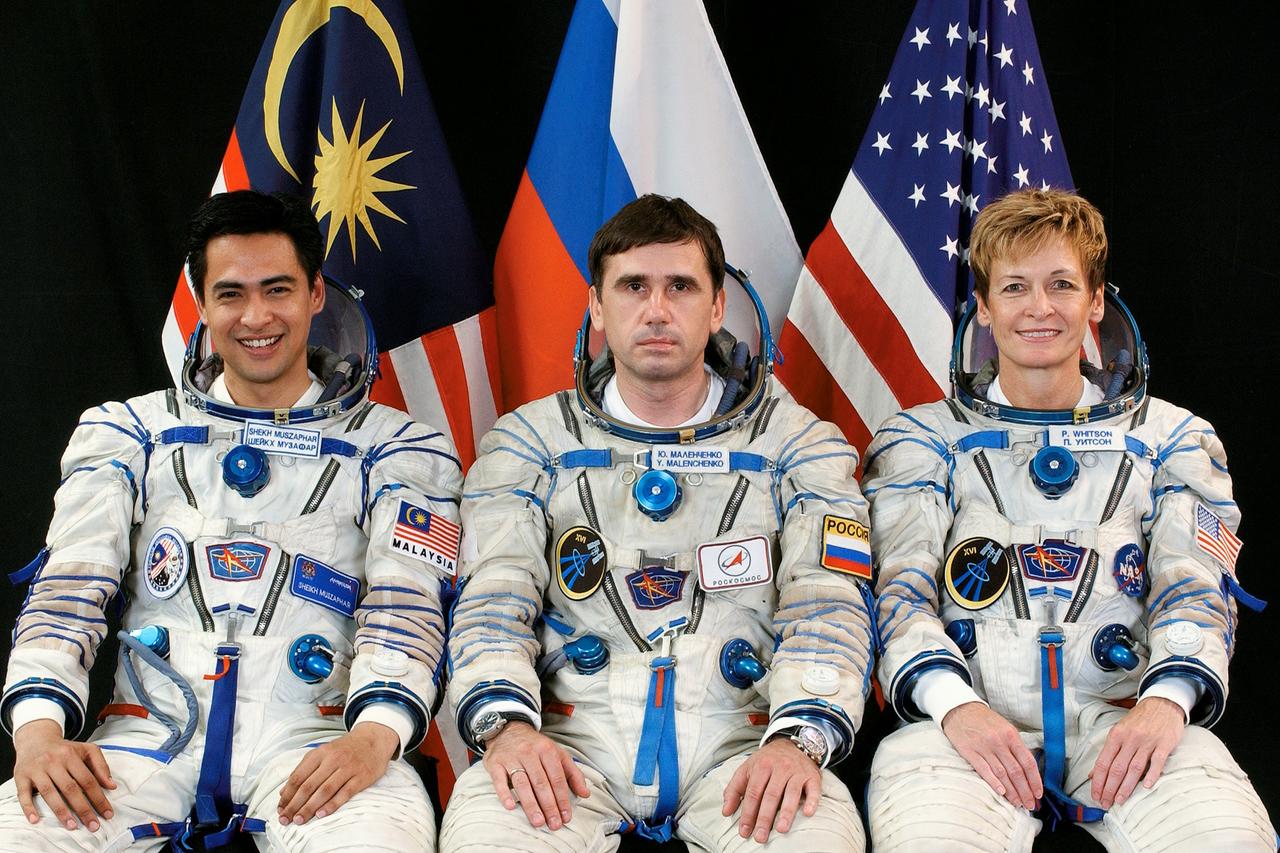 JSC2007-E-45197 (July 2007) --- Attired in Russian Sokol launch and entry suits, NASA astronaut Peggy A. Whitson (right), Expedition 16 commander; cosmonaut Yuri I. Malenchenko, Soyuz commander and flight engineer representing Russia's Federal Space Agency; and Malaysian spaceflight participant Sheikh Muszaphar Shukor take a break from training in Star City, Russia to pose for a portrait. Whitson, Malenchenko and Shukor are scheduled to launch to the International Space Station in a Soyuz spacecraft in October. Photo credit: Gagarin Cosmonaut Training Center