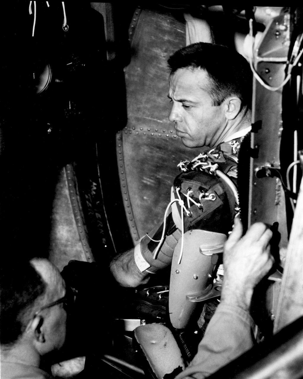JSC2007-E-046476 (1961) --- Astronaut Alan B. Shepard Jr., one of three NASA astronauts chosen for the Project Mercury first manned suborbital flight, prepares for testing in a capsule of the U.S. Navy's centrifuge at Johnsville, Pennsylvania. Original photo number was 61-MR3-19. Photo credit: NASA or National Aeronautics and Space Administration