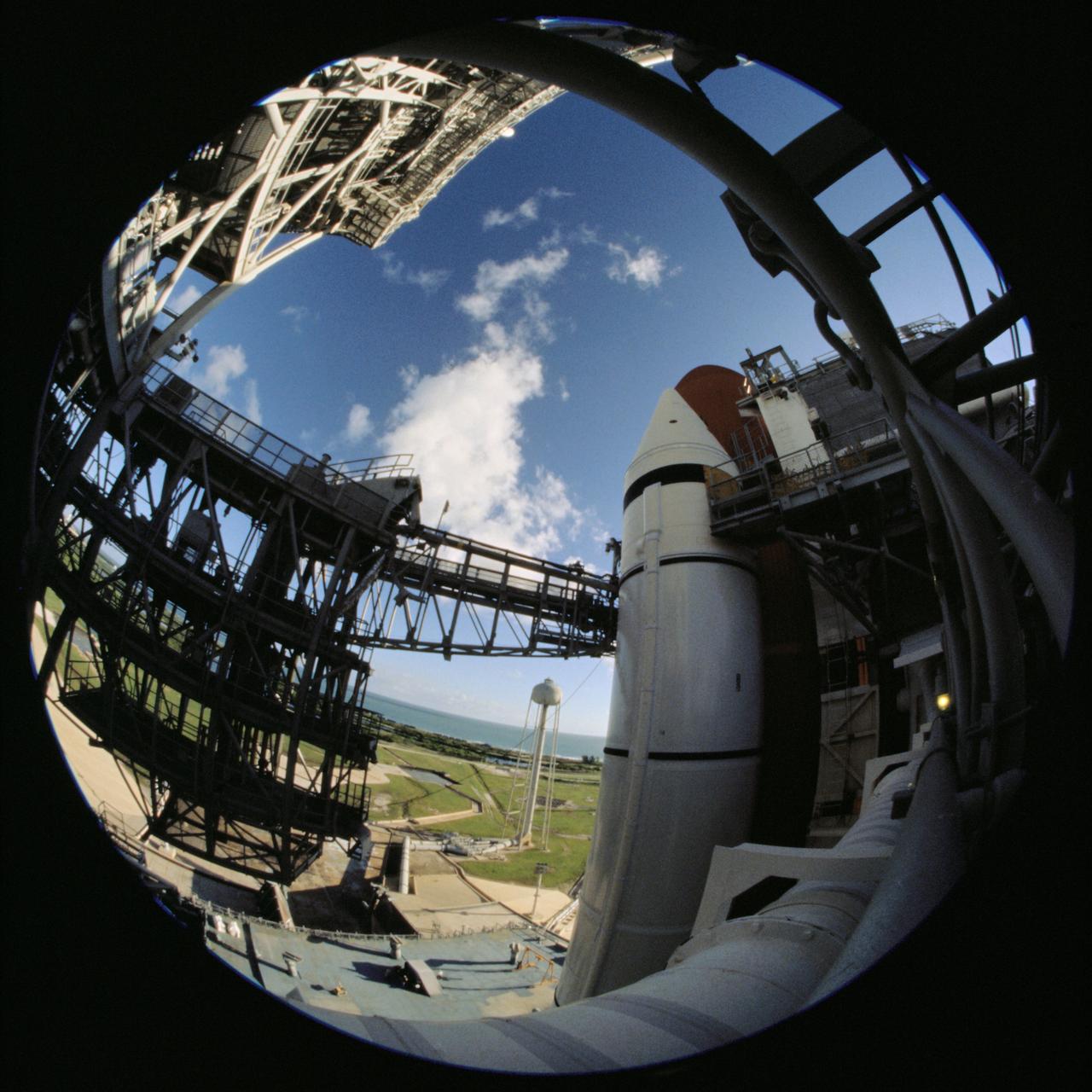 JSC2007-E-53782 (8-10 Oct. 2007) --- A photographer used a fish-eye lens attached to an electronic still camera to record a series of photos of the Space Shuttle Discovery at the launch pad while the STS-120 crew was at Kennedy Space Center for the Terminal Countdown Demonstration Test in October 2007.