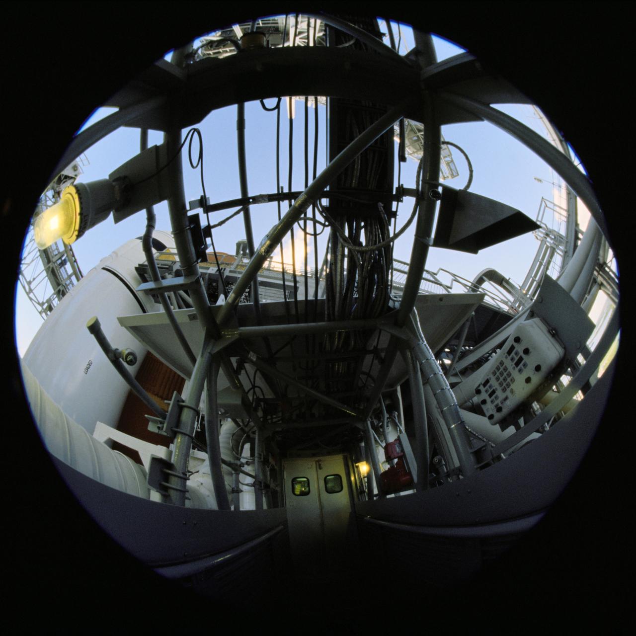 JSC2007-E-53783 (8-10 Oct. 2007) --- A photographer used a fish-eye lens attached to an electronic still camera to record a series of photos of the Space Shuttle Discovery at the launch pad while the STS-120 crew was at Kennedy Space Center for the Terminal Countdown Demonstration Test in October 2007.
