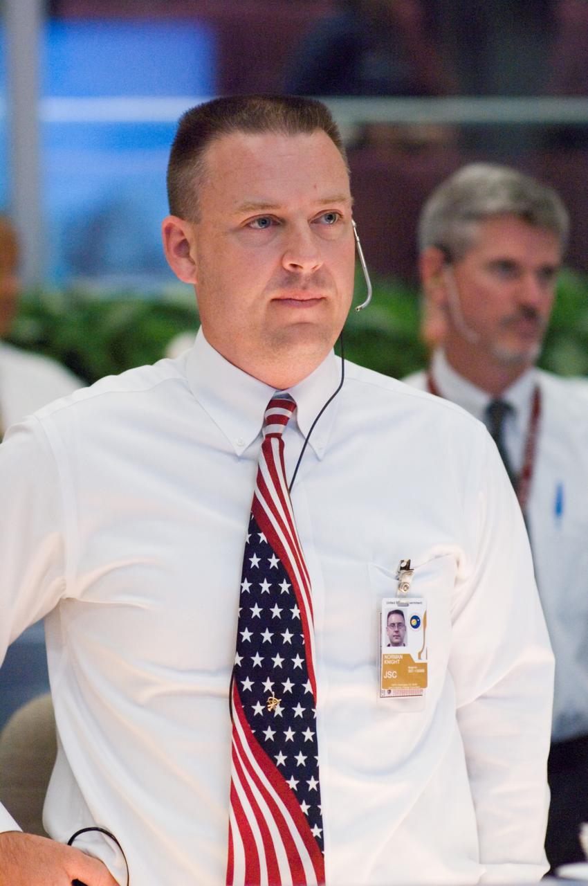 JSC2007-E-053899 (23 Oct. 2007) --- Flight director Norm Knight watches the big screens in the space shuttle flight control room of Johnson Space Center's Mission Control Center (MCC) during launch countdown activities a few hundred miles away in Florida, site of Space Shuttle Discovery's scheduled STS-120 launch. Liftoff occurred at 11:38 a.m. (EDT) on Oct. 23, 2007 from launch pad 39A at Kennedy Space Center.