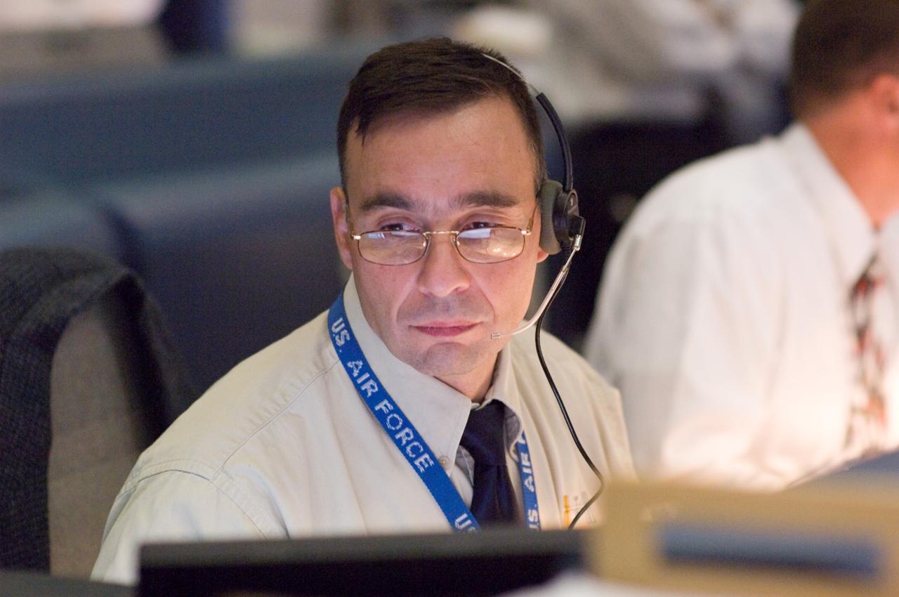 JSC2007-E-053905 (23 Oct. 2007) --- Astronaut Lee J. Archambault, spacecraft communicator (CAPCOM), monitors data at his console in the space shuttle flight control room of Johnson Space Center's Mission Control Center (MCC) during launch countdown activities a few hundred miles away in Florida, site of Space Shuttle Discovery's scheduled STS-120 launch. Liftoff occurred at 11:38 a.m. (EDT) on Oct. 23, 2007 from launch pad 39A at Kennedy Space Center.