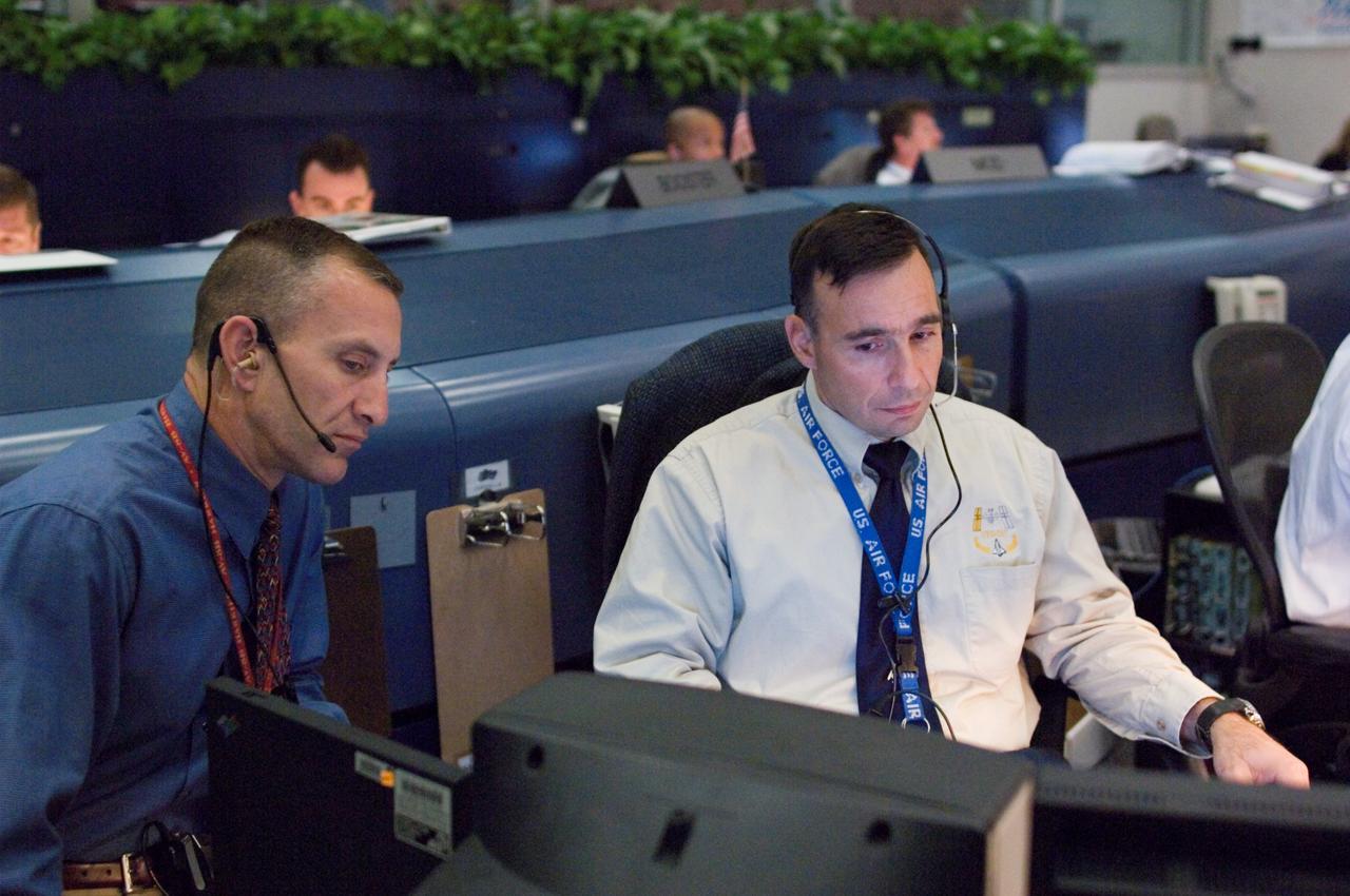 JSC2007-E-053913 (23 Oct. 2007) --- Astronauts Lee J. Archambault (right) and Charles O. Hobaugh, spacecraft communicators (CAPCOM), monitor data at their consoles in the space shuttle flight control room of Johnson Space Center's Mission Control Center (MCC) during launch countdown activities a few hundred miles away in Florida, site of Space Shuttle Discovery's scheduled STS-120 launch. Liftoff occurred at 11:38 a.m. (EDT) on Oct. 23, 2007 from launch pad 39A at Kennedy Space Center.