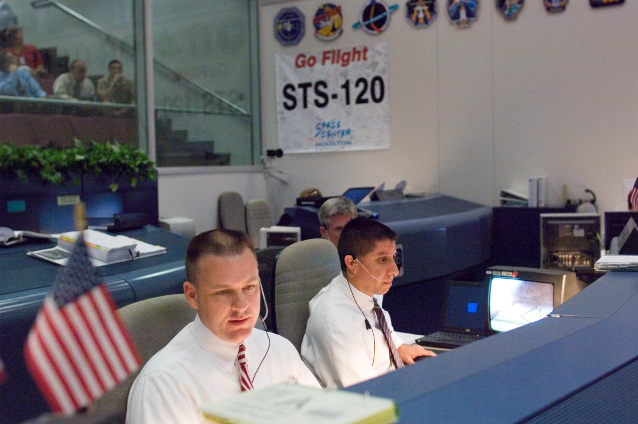 JSC2007-E-053916 (23 Oct. 2007) --- Flight directors Norm Knight (left) and Richard Jones monitor data at their consoles in the space shuttle flight control room of Johnson Space Center's Mission Control Center (MCC) during launch countdown activities a few hundred miles away in Florida, site of Space Shuttle Discovery's scheduled STS-120 launch. Liftoff occurred at 11:38 a.m. (EDT) on Oct. 23, 2007 from launch pad 39A at Kennedy Space Center.