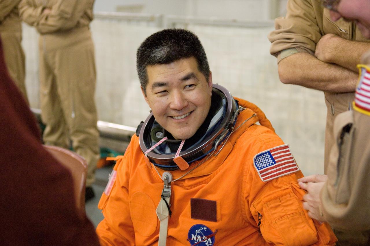 JSC2007-E-06401 (31 Jan. 2007) --- Attired in a training version of his shuttle launch and entry suit, astronaut Daniel M. Tani, Expedition 16 flight engineer, awaits the start of a water survival training session in the Neutral Buoyancy Laboratory (NBL) near Johnson Space Center. Tani will join Expedition 16 as flight engineer after launching to the International Space Station aboard Atlantis on mission STS-120 and will return home aboard Discovery on mission STS-122.