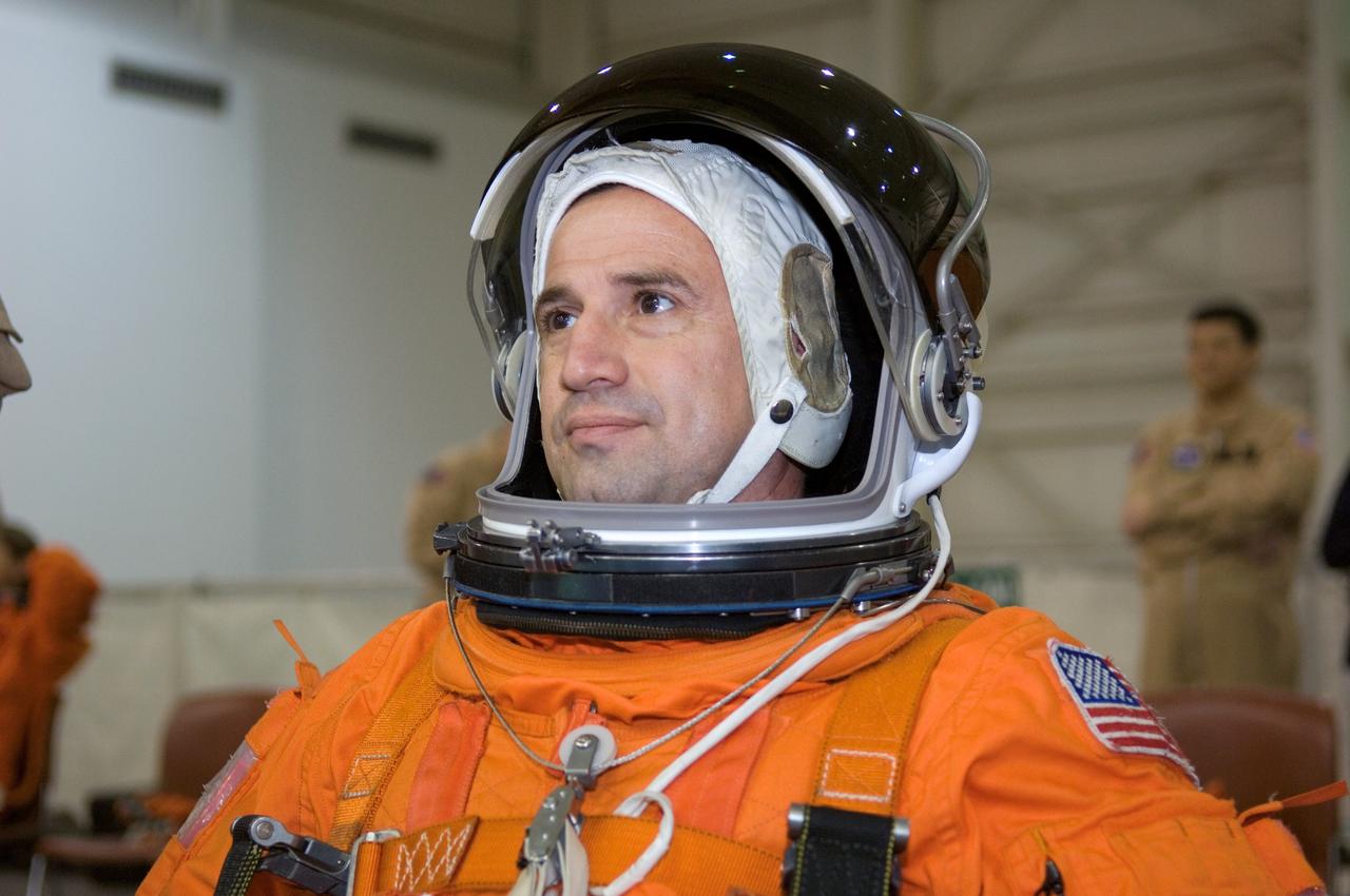 JSC2007-E-06419 (31 Jan. 2007) --- Astronaut George D. Zamka, STS-120 pilot, attired in a training version of his shuttle launch and entry suit, awaits the start of a water survival training session in the Neutral Buoyancy Laboratory (NBL) near Johnson Space Center.