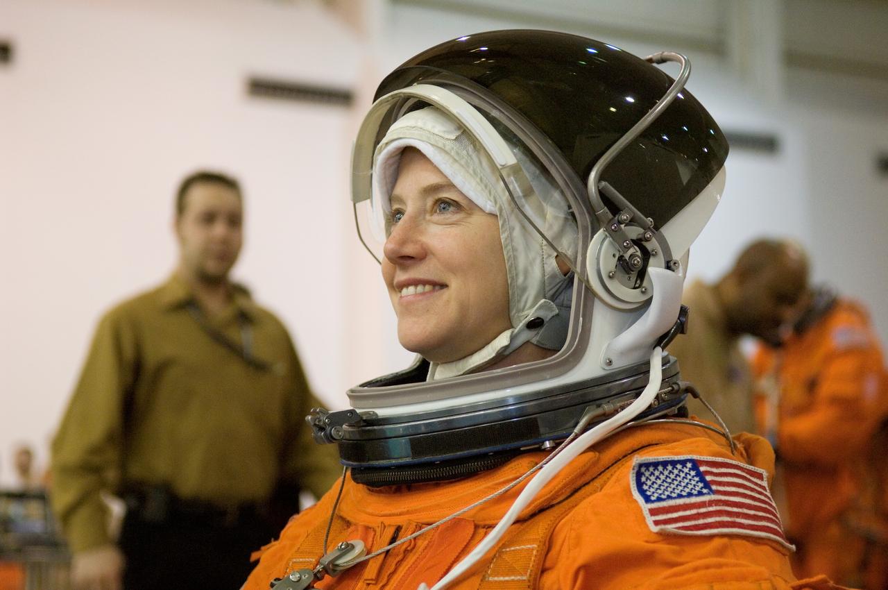 JSC2007-E-06440 (31 Jan. 2007) --- Astronaut Pamela A. Melroy, STS-120 commander, attired in a training version of her shuttle launch and entry suit, awaits the start of a water survival training session in the Neutral Buoyancy Laboratory (NBL) near Johnson Space Center.