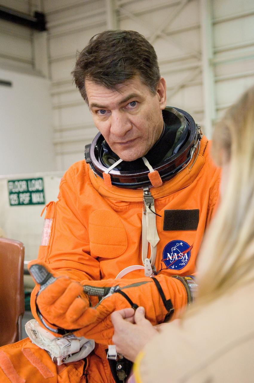 JSC2007-E-06442 (31 Jan. 2007) --- European Space Agency (ESA) astronaut Paolo Nespoli, STS-120 mission specialist, dons a training version of his shuttle launch and entry suit in preparation for a water survival training session in the Neutral Buoyancy Laboratory (NBL) near Johnson Space Center.