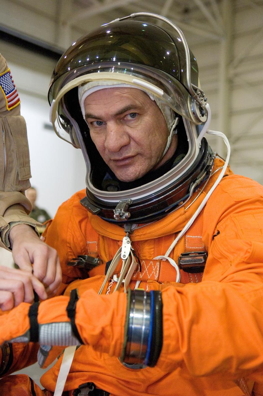 JSC2007-E-06455 (31 Jan. 2007) --- European Space Agency (ESA) astronaut Paolo Nespoli, STS-120 mission specialist, dons a training version of his shuttle launch and entry suit in preparation for a water survival training session in the Neutral Buoyancy Laboratory (NBL) near Johnson Space Center.