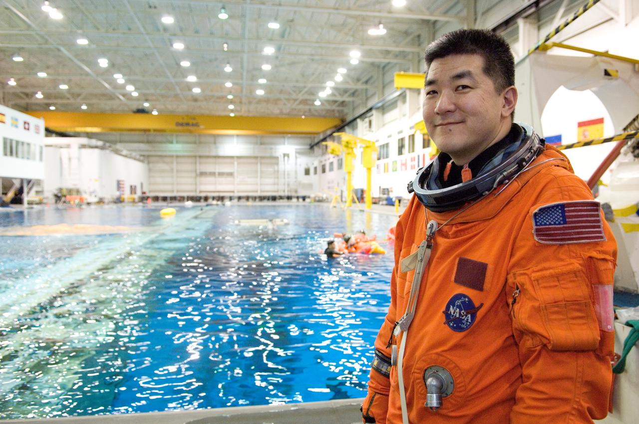 JSC2007-E-06461 (31 Jan. 2007) --- Attired in a training version of his shuttle launch and entry suit, astronaut Daniel M. Tani, Expedition 16 flight engineer, awaits the start of a water survival training session in the Neutral Buoyancy Laboratory (NBL) near Johnson Space Center. Tani will join Expedition 16 as flight engineer after launching to the International Space Station aboard Atlantis on mission STS-120 and will return home aboard Discovery on mission STS-122.