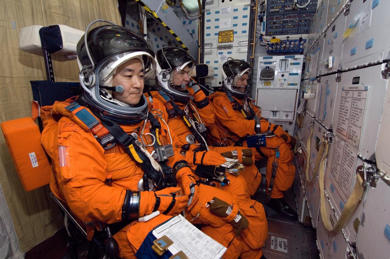 JSC2007-E-08831 (7 Feb. 2007) --- Astronauts Daniel M. Tani (left), Expedition 16 flight engineer; European Space Agency's (ESA) Paolo Nespoli and Scott E. Parazynski, both STS-120 mission specialists, participate in a training session in one of the full-scale trainers in the Space Vehicle Mockup Facility at Johnson Space Center. Attired in training versions of their shuttle launch and entry suit, the three are seated on the middeck for a post insertion training session. Tani will join Expedition 16 as flight engineer after launching to the International Space Station aboard Atlantis on mission STS-120 and is scheduled to return home aboard Discovery on mission STS-122.