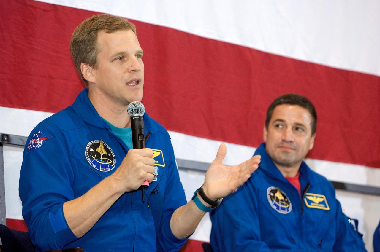 JSC2007-E-098006 (8 Nov. 2007) --- The crew of the STS-120 mission was welcomed home to Houston Nov. 8, following the landing of Space Shuttle Discovery in Florida on Nov. 7. Astronaut Scott Parazynski, who participated in all four STS-120 spacewalks, addresses well-wishers. Astronaut George Zamka, pilot, looks on. Not pictured are astronaut Pam Melroy, commander, and mission specialists Scott Parazynski, Stephanie Wilson, Doug Wheelock, Paolo Nespoli (ESA) and Clay Anderson (all out of frame). The astronauts were welcomed by family and friends during an afternoon ceremony at Houston's Ellington Field.