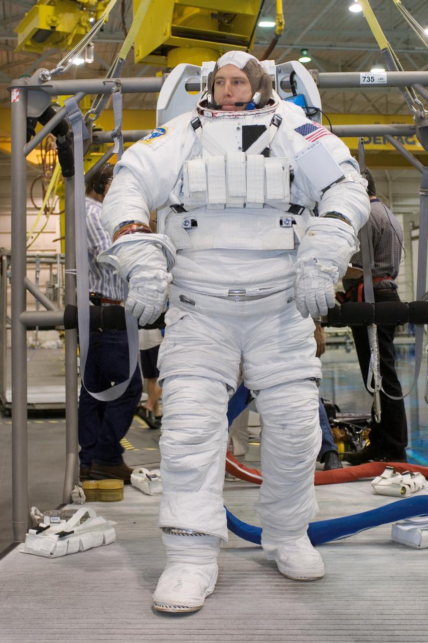 JSC2007-E-113487 (17 Dec. 2007) --- Astronaut Andrew J. Feustel, STS-125 mission specialist, attired in a training version of the Extravehicular Mobility Unit (EMU) spacesuit, awaits the start of a training session in the waters of the Neutral Buoyancy Laboratory (NBL) near Johnson Space Center.