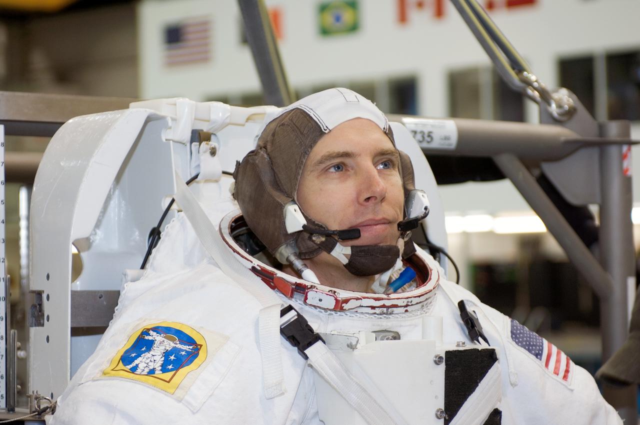 JSC2007-E-113488 (17 Dec. 2007) --- Astronaut Andrew J. Feustel, STS-125 mission specialist, attired in a training version of the Extravehicular Mobility Unit (EMU) spacesuit, awaits the start of a training session in the waters of the Neutral Buoyancy Laboratory (NBL) near Johnson Space Center.