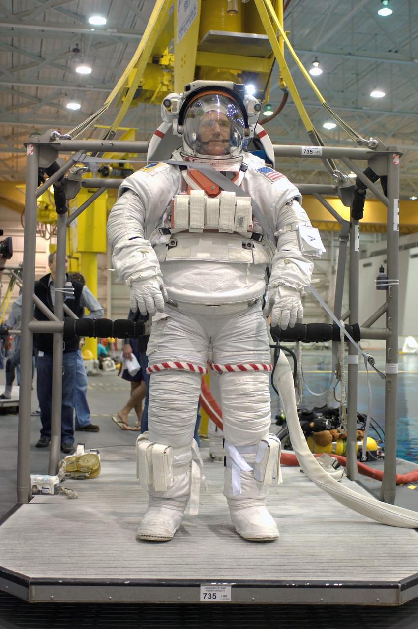 JSC2007-E-113605 (18 Dec. 2007) --- Astronaut Michael T. Good STS-125 mission specialist, attired in a training version of the Extravehicular Mobility Unit (EMU) spacesuit, awaits the start of a training session in the waters of the Neutral Buoyancy Laboratory (NBL) near Johnson Space Center.