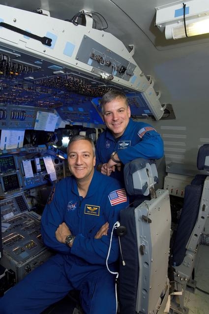 NASA image: STS-125 Astronauts Massimino and Johnson pose for Magazine Cover