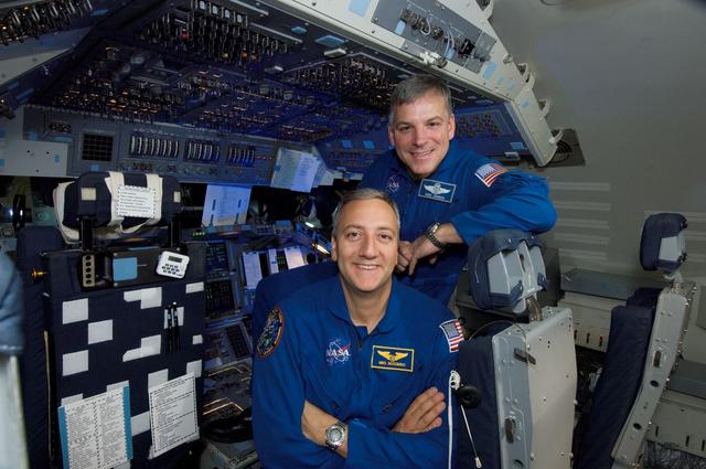 NASA image: STS-125 Astronauts Massimino and Johnson pose for Magazine Cover