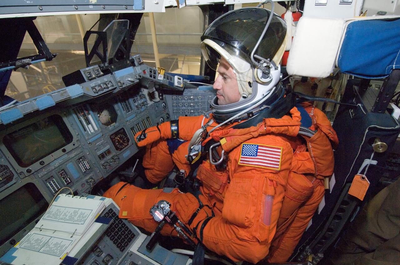 JSC2007-E-18070 (9 April 2007) --- While seated at the pilot's station, astronaut George D. Zamka, STS-120 pilot, participates in a training session in the crew compartment trainer (CCT-2) in the Space Vehicle Mockup Facility at Johnson Space Center. Zamka is wearing a training version of his shuttle launch and entry suit.