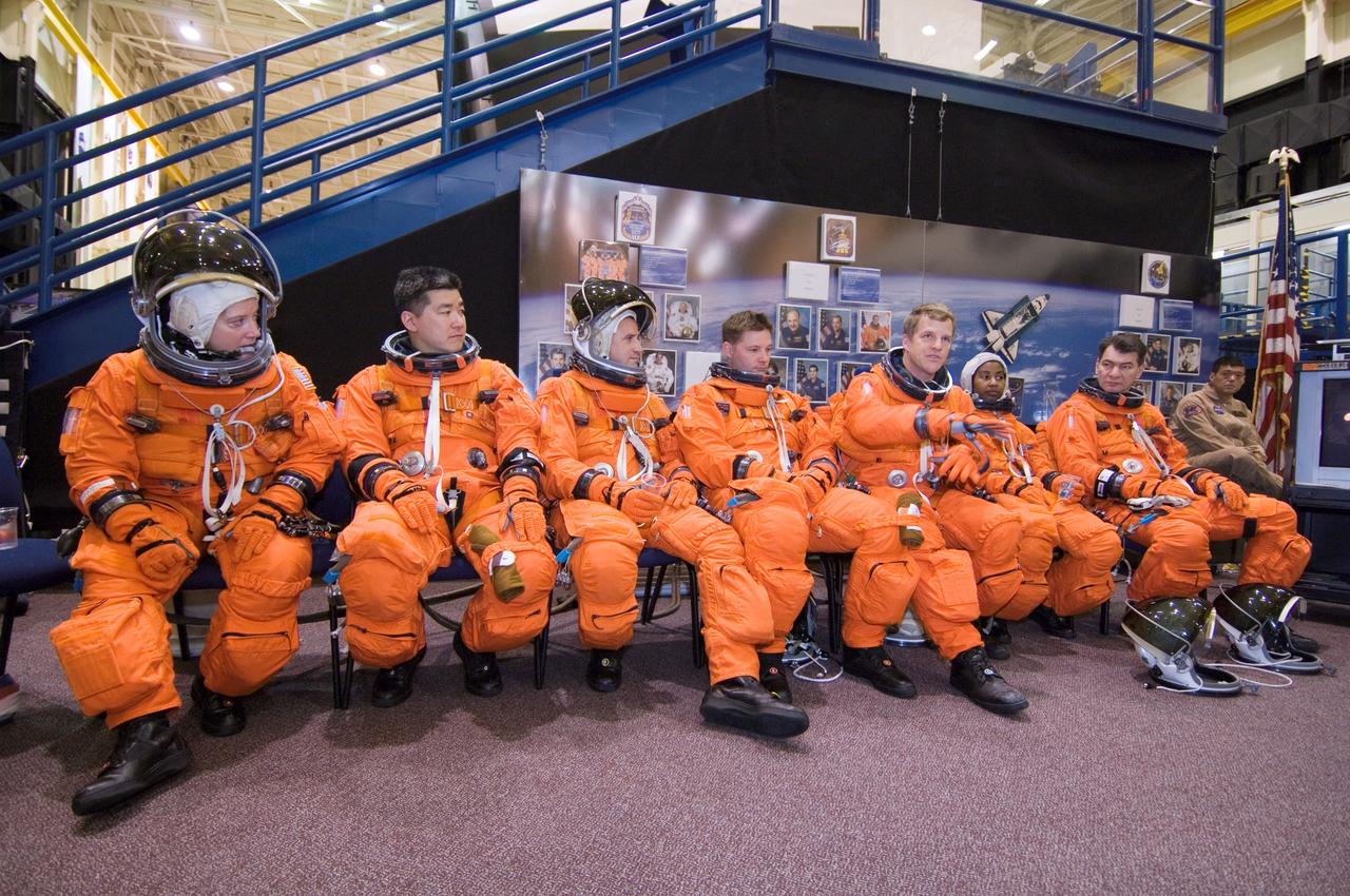 JSC2007-E-18090 (9 April 2007) --- Attired in training versions of their shuttle launch and entry suits, the STS-120 crewmembers await the start of a training session in the Space Vehicle Mockup Facility at Johnson Space Center. From the left are astronauts Pamela A. Melroy, STS-120 commander; Daniel M. Tani, Expedition 16 flight engineer; George D. Zamka, STS-120 pilot; Douglas H. Wheelock, Scott E. Parazynski, Stephanie D. Wilson and European Space Agency's (ESA) Paolo Nespoli, all mission specialists. Tani is scheduled to join Expedition 16 as flight engineer after launching to the International Space Station on mission STS-120 and is scheduled to return home on mission STS-122.
