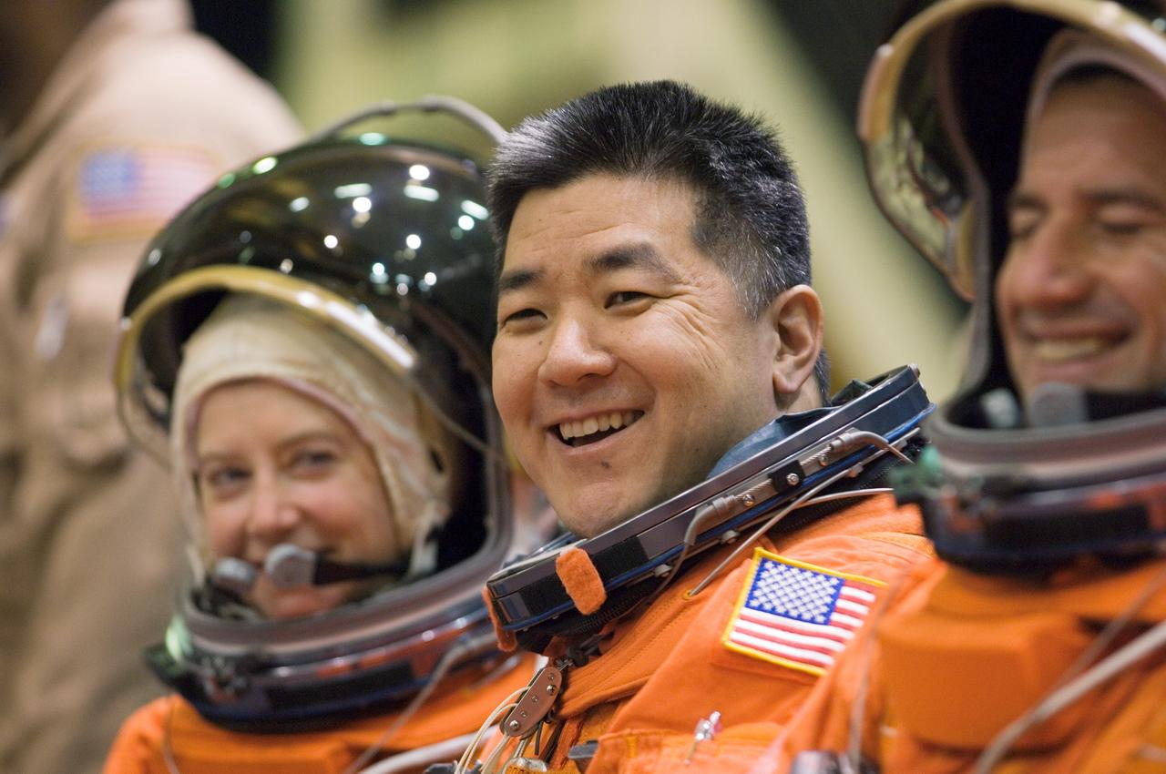 JSC2007-E-18096 (9 April 2007) --- Astronauts Pamela A. Melroy (left), STS-120 commander; Daniel M. Tani, Expedition 16 flight engineer; and George D. Zamka, STS-120 pilot, enjoy a light moment as they await the start of a training session in the Space Vehicle Mockup Facility at Johnson Space Center. Tani is scheduled to join Expedition 16 as flight engineer after launching to the International Space Station on mission STS-120 and is scheduled to return home on mission STS-122.