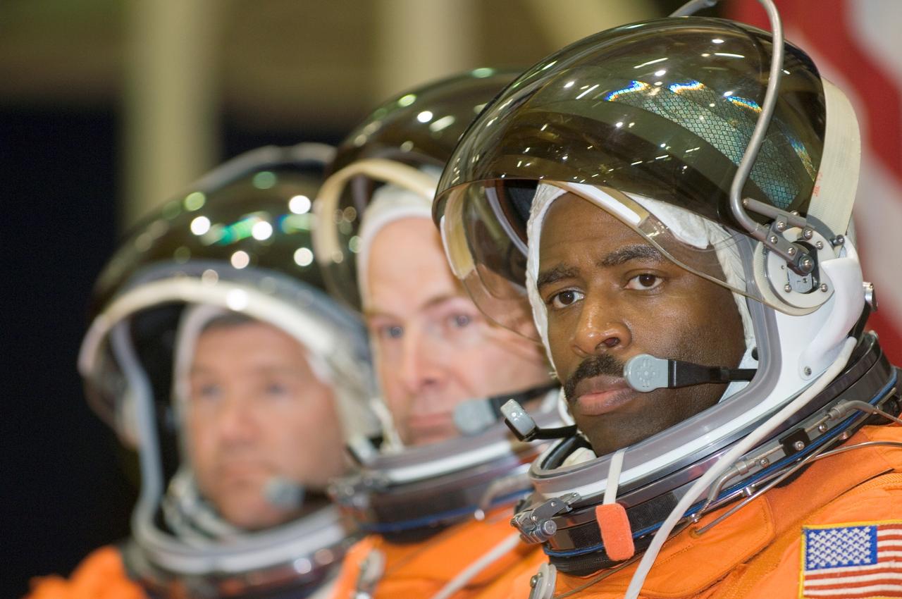 JSC2007-E-21251 (1 May 2007) --- Astronauts Stephen N. Frick (left), STS-122 commander; Alan G. Poindexter, pilot; and Leland D. Melvin, mission specialist, await the start of an emergency egress training session in the Space Vehicle Mockup Facility at Johnson Space Center. The crewmembers are wearing training versions of their shuttle launch and entry suits.
