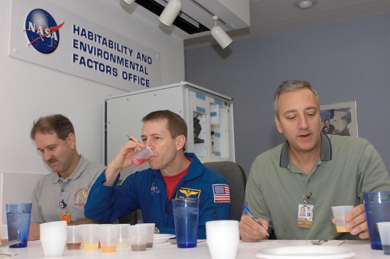 JSC2008-E-006896 (24 Jan. 2008) --- Astronauts John M. Grunsfeld (left), STS-125 mission specialist; Gregory C. Johnson, pilot; and Michael J. Massimino, mission specialist, participate in a food tasting session in the Flight Projects Division Laboratory at the Johnson Space Center.