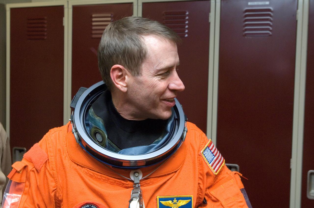JSC2008-E-018320 (27 Feb. 2008) --- Attired in a training version of his shuttle launch and entry suit, astronaut Gregory C. Johnson, STS-125 pilot, awaits the start of a training session in the Space Vehicle Mockup Facility at Johnson Space Center.