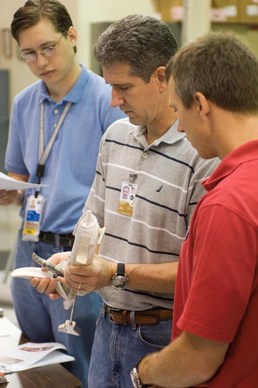 JSC2008-E-031809 (2 April 2008) --- Astronauts Andrew J. Feustel (right) and Michael T. Good, both STS-125 mission specialists, participate in an extravehicular activity (EVA) hardware training session in the Space Vehicle Mockup Facility at NASA's Johnson Space Center.