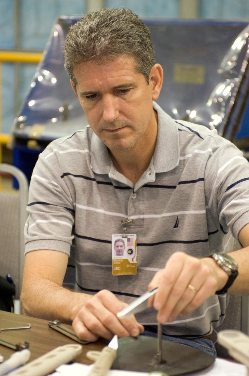 JSC2008-E-031811 (2 April 2008) --- Astronaut Michael T. Good, STS-125 mission specialist, participates in an extravehicular activity (EVA) hardware training session in the Space Vehicle Mockup Facility at NASA's Johnson Space Center.