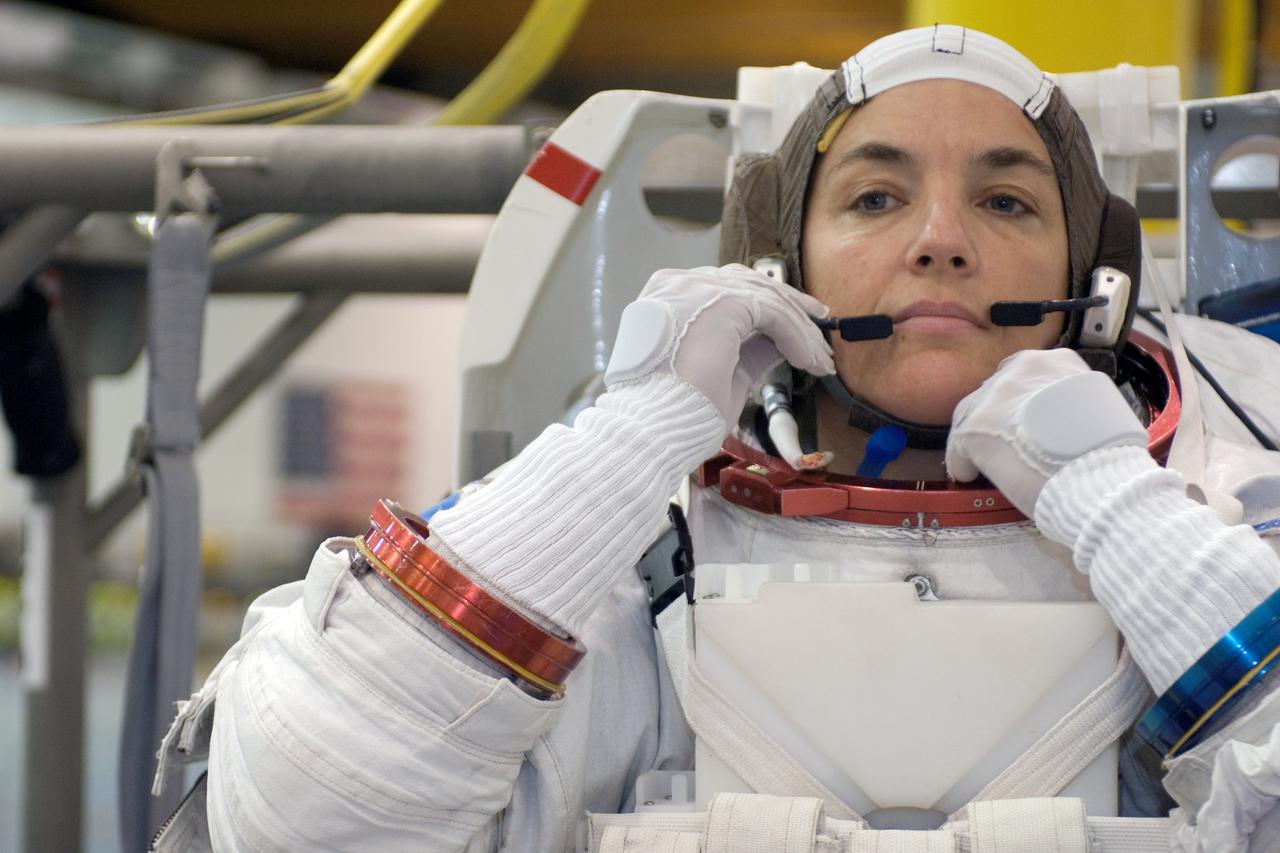 JSC2008-E-031871 (3 April 2008) --- Astronaut Heidemarie M. Stefanyshyn-Piper, STS-126 mission specialist, makes final touches on a training version of her Extravehicular Mobility Unit (EMU) spacesuit in preparation for a training session in the waters of the Neutral Buoyancy Laboratory (NBL) near NASA's Johnson Space Center.