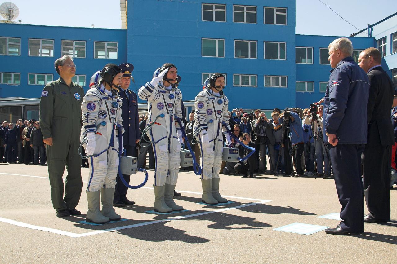 JSC2008-E-032794 (8 April 2008) --- At the Baikonur Cosmodrome in Kazakhstan, Expedition 17 Commander Sergei Volkov (center), Flight Engineer Oleg Kononenko (right) and South Korean spaceflight participant So-yeon Yi bid farewell to Anatoly Perminov, the head of the Russian Federal Space Agency on April 8, 2008, prior to heading to the launch pad for their liftoff on the Soyuz TMA-12 spacecraft to the International Space Station. Volkov and Kononenko will spend six months on the station, while Yi will spend nine days on the complex under a commercial agreement between South Korea and the Russian Federal Space Agency. Photo Credit: NASA /Victor Zelentsov