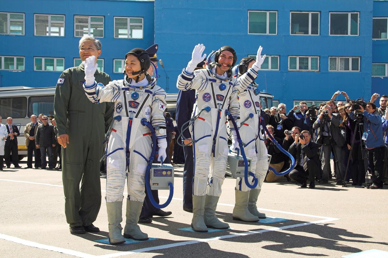 JSC2008-E-032795 (8 April 2008) --- At the Baikonur Cosmodrome in Kazakhstan, Expedition 17 Commander Sergei Volkov (center), Flight Engineer Oleg Kononenko (right) and South Korean spaceflight participant So-yeon Yi bid farewell to well wishers April 8, 2008 prior to heading to the launch pad for their liftoff on the Soyuz TMA-12 spacecraft to the International Space Station. Volkov and Kononenko will spend six months on the station, while Yi will spend nine days on the complex under a commercial agreement between South Korea and the Russian Federal Space Agency. Photo Credit: NASA /Victor Zelentsov