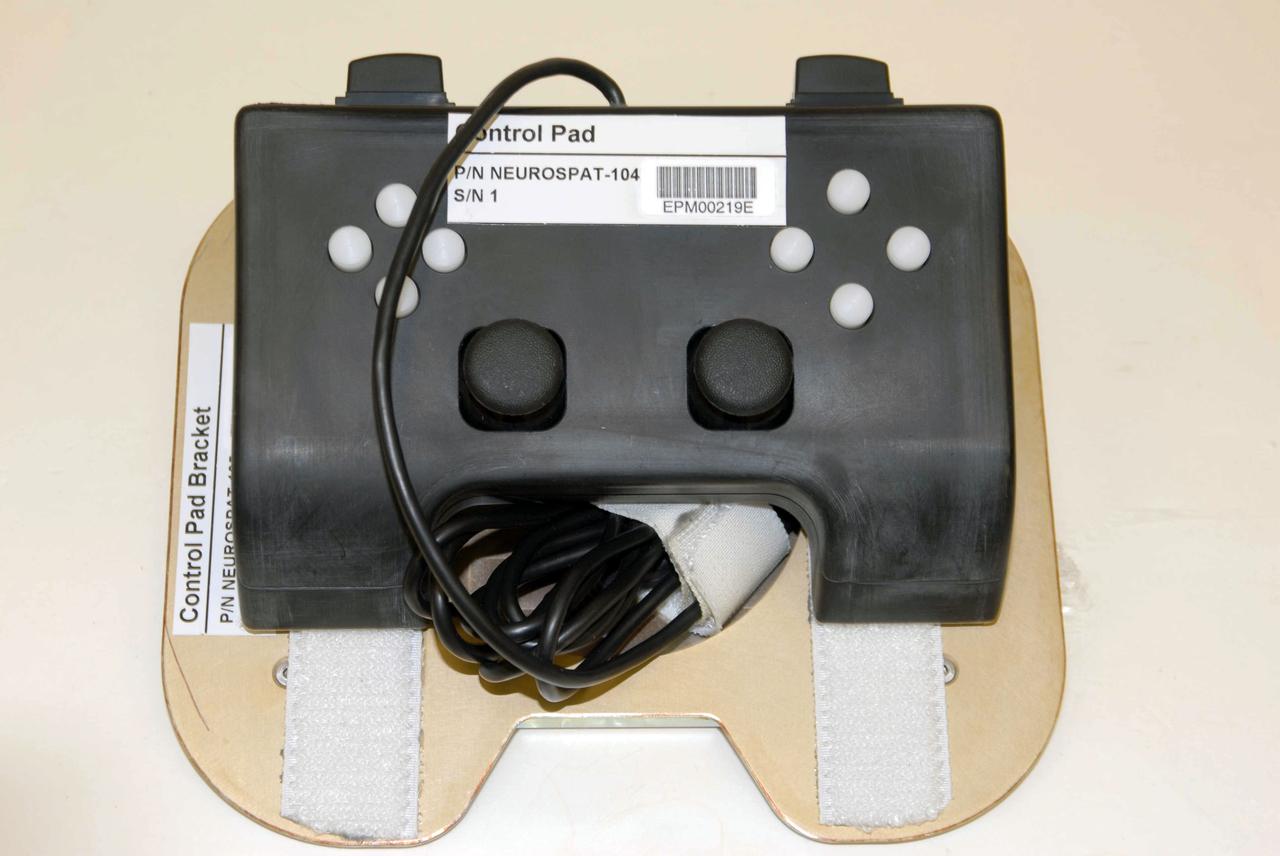 jsc2008e032966 (Apr. 9, 2008) --- Neurospat Control pad bracket at NASA's Johnson Space Center to be delivered to the International Space Station (ISS). Neurospat investigates ways in which crew member's three-dimensional visual and space perception is affected by long-duration stays in weightlessness to help in help in finding and developing countermeasures alleviating any disorientation experienced by astronauts.