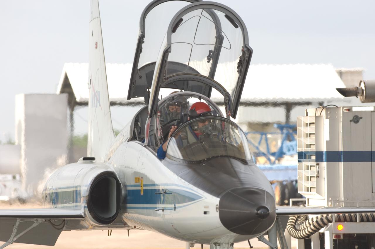 JSC2008-E-035367 (17 April 2008) --- Astronauts Scott D. Altman (front seat) and Michael J. Massimino, STS-125 commander and mission specialist, respectively, prepare for a flight in a NASA T-38 trainer jet at Ellington Field near NASA's Johnson Space Center.