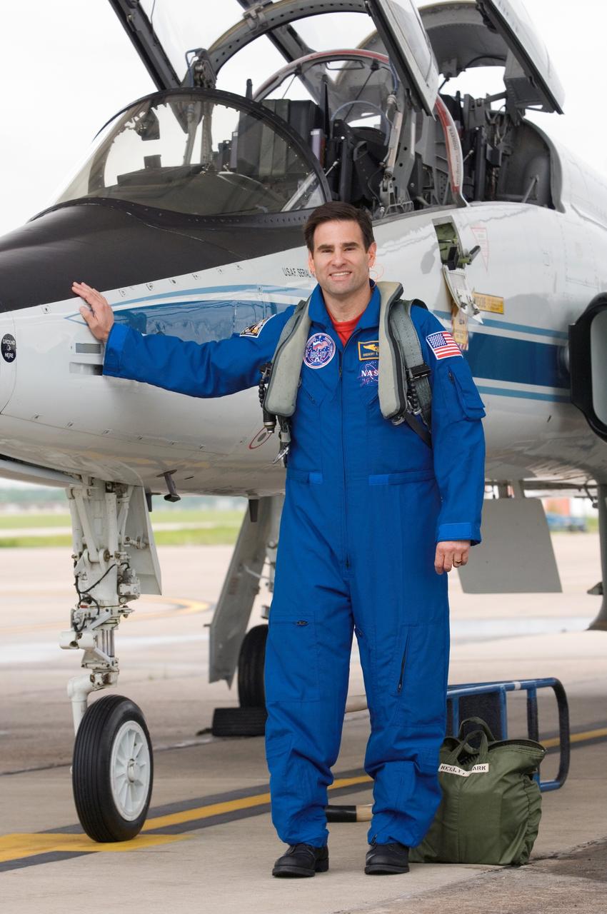 JSC2008-E-038909 (6 May 2008) --- Astronaut Greg Chamitoff, STS-124 mission specialist, takes a moment for a photo near a NASA T-38 trainer jet prior to a flight from Ellington Field near NASA's Johnson Space Center to Kennedy Space Center, Florida. Chamitoff is scheduled to join Expedition 17 as flight engineer after launching to the International Space Station on mission STS-124.