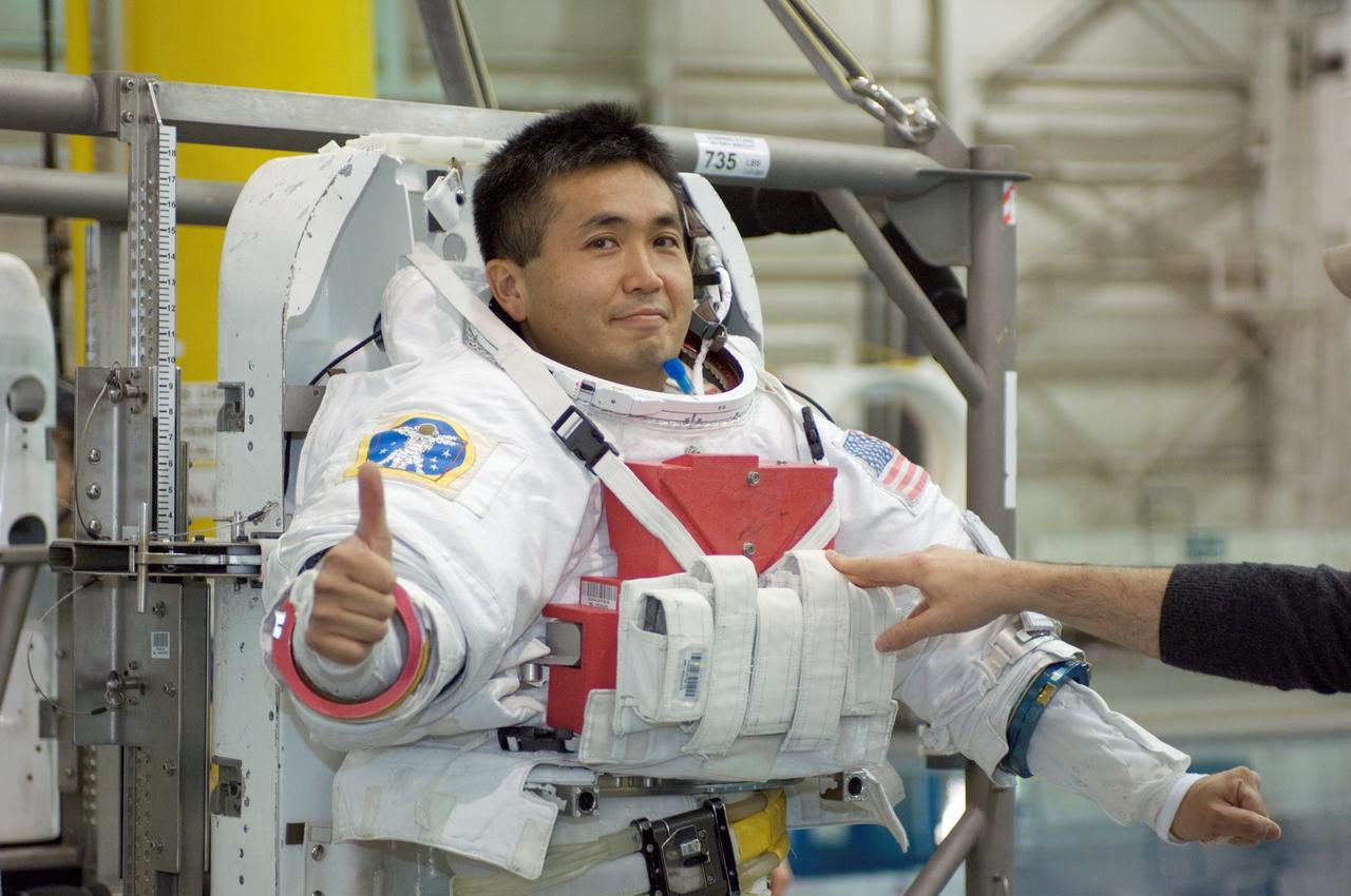 JSC2008-E-039235 (12 May 2008) --- Japan Aerospace Exploration Agency (JAXA) astronaut Koichi Wakata, Expedition 18 flight engineer, gives a "thumbs-up" signal as he awaits the start of a training session in the waters of the Neutral Buoyancy Laboratory (NBL) near NASA's Johnson Space Center. Wakata is attired in a training version of the Extravehicular Mobility Unit (EMU) spacesuit.