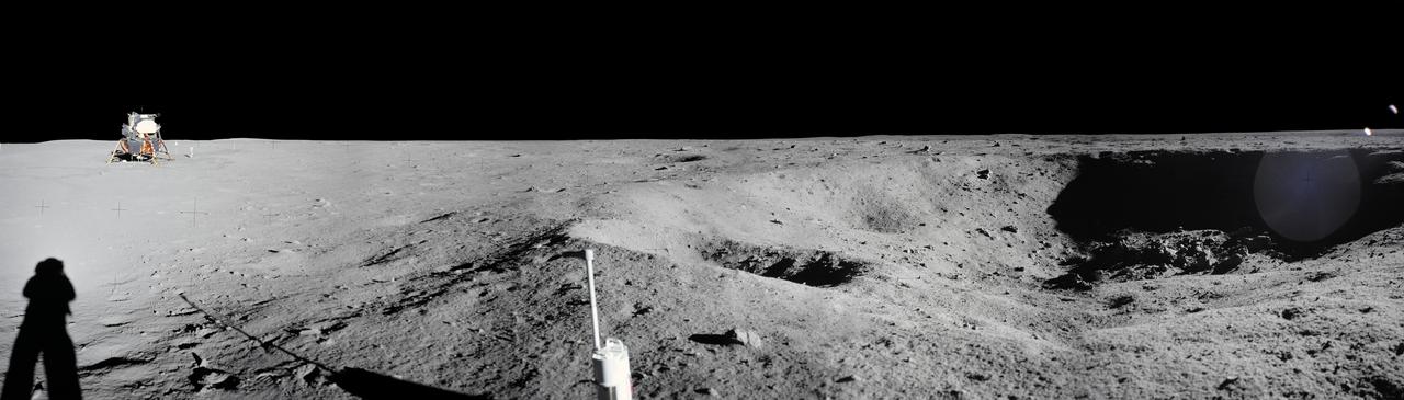 jsc2008e040725 - Panorama view of Apollo 11 Lunar surface photos taken by Astronaut Neil Armstrong at Tranquility Base of a crater Armstrong noted during the Lunar Module descent. The panoramas were built by combining Apollo 11 images starting with frame AS11-40-5954 through end frame AS11-40-5961. The panoramic images received minimal retouching by NASA imagery specialists, including the removal of lens flares that were problematic in stitching together the individual frames and blacking out the sky to the lunar horizon. These adjustments were made based on observations of the Moon walkers who reported that there are no stars visible in the sky due to the bright lunar surface reflection of the Sun.