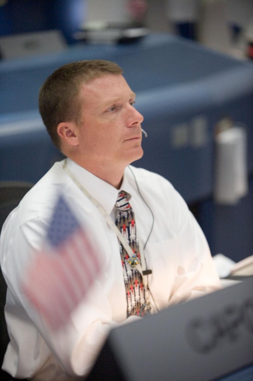 JSC2008-E-046931 (14 June 2008) --- Astronaut Terry Virts, STS-124 spacecraft communicator (CAPCOM), watches the big screens in the space shuttle flight control room in the Mission Control Center at NASA's Johnson Space Center during the landing of Space Shuttle Discovery at NASA's Kennedy Space Center, Fla.