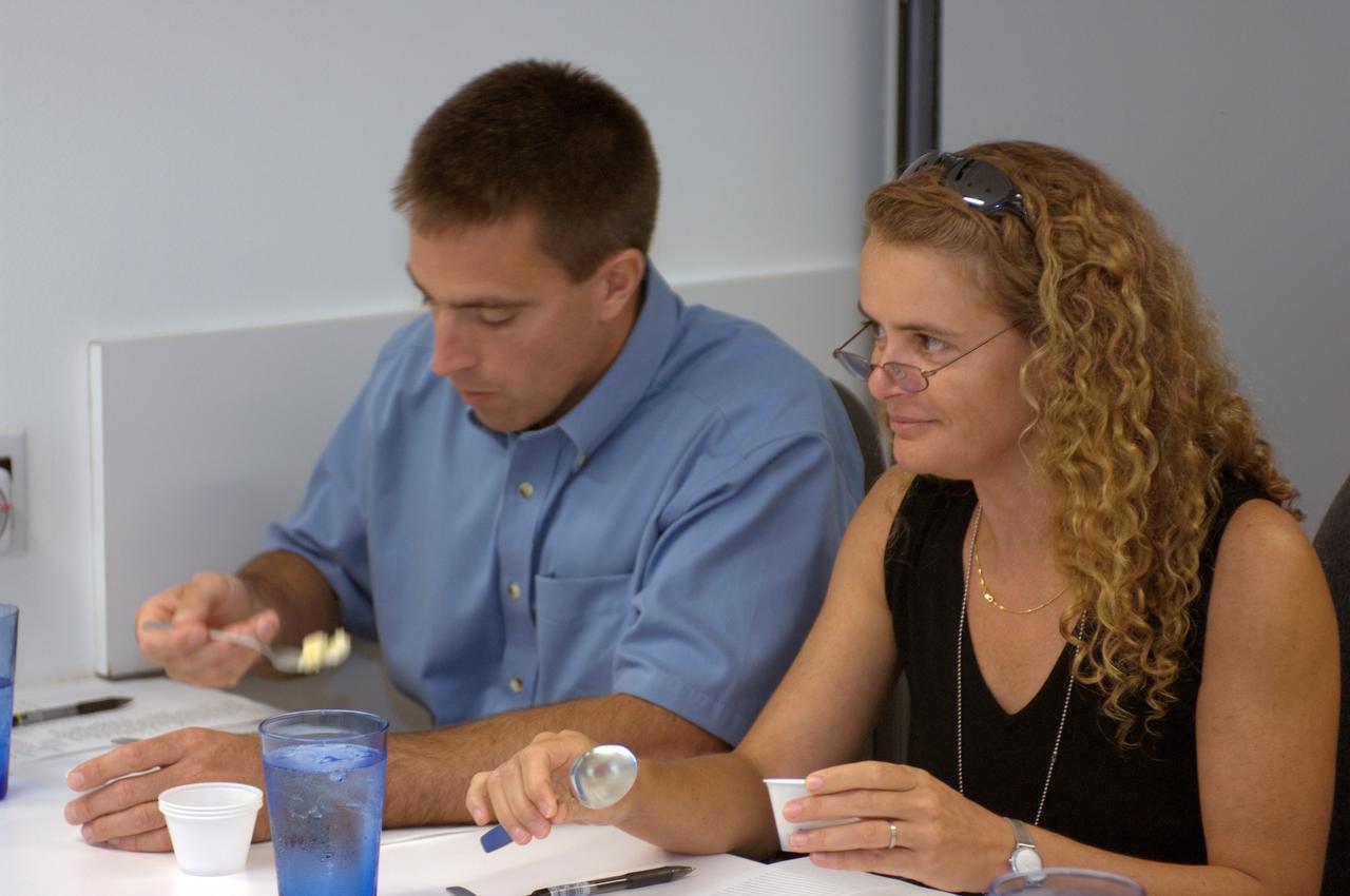 JSC2008-E-047939 (19 June 2008) --- NASA astronaut Christopher J. Cassidy and Canadian Space Agency astronaut Julie Payette, both STS-127 mission specialists, participate in a food tasting session in the Flight Projects Division Laboratory at NASA's Johnson Space Center.