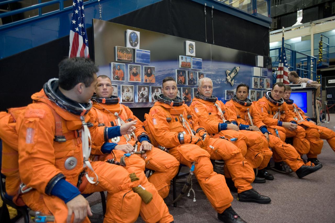 JSC2008-E-052124 (16 July 2008) --- Attired in training versions of their shuttle launch and entry suits, the STS-119 crewmembers await the start of a training session in the Space Vehicle Mockup Facility at Johnson Space Center. From the left are Japan Aerospace Exploration Agency astronaut Koichi Wakata, Expedition 18 flight engineer; NASA astronauts Tony Antonelli, STS-119 pilot; Lee Archambault, commander; John Phillips, Joseph Acaba, Richard Arnold and Steve Swanson, all mission specialists.